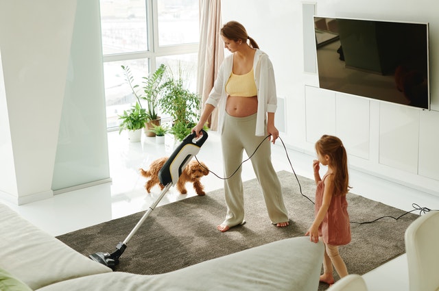 Child and mother cleaning room - Reasons Why Air Conditioners are Great to Have in Your Home