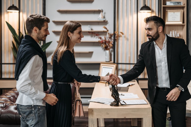 Lawyer shaking hands with clients 1 - About the Time Limits of Your Insurance Claims