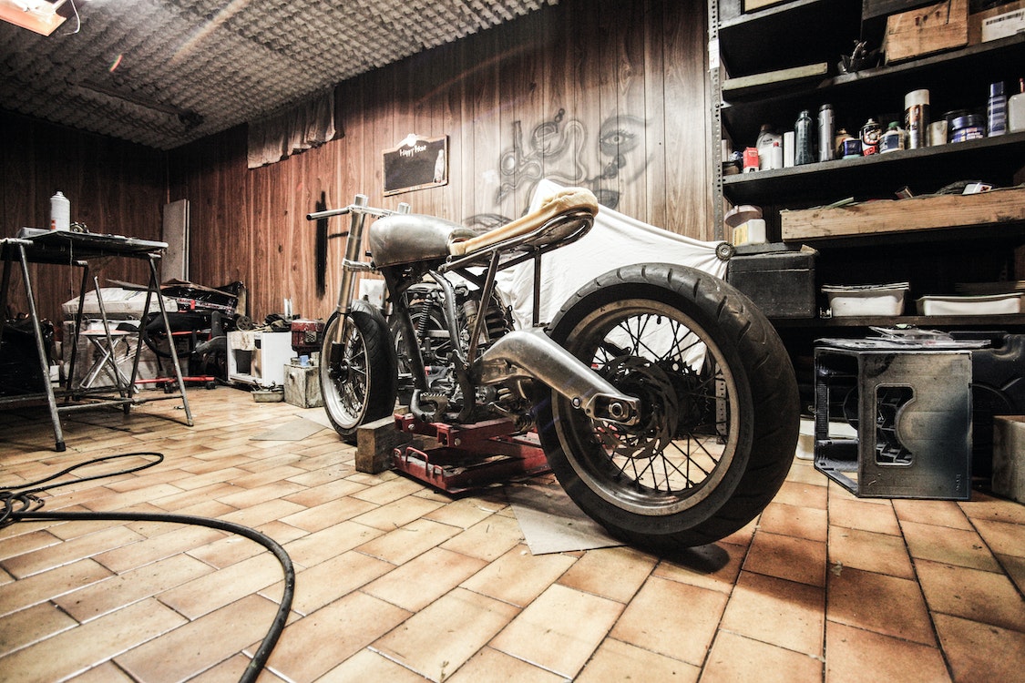 motorbike in garage - Reasons Why Epoxy Flooring Is the Best Option for Your Garage
