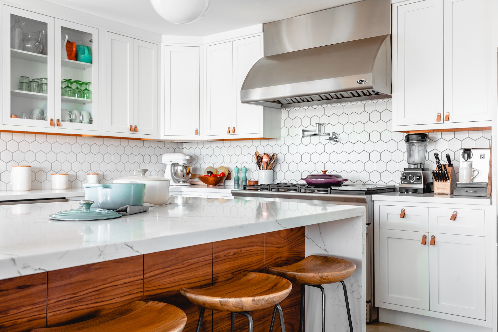 white kitchen with wood chairs - Tips From the Pros to Help You Master Home Remodeling