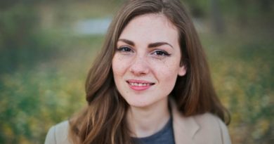 The Art of Retouching Headshot Photos woman wearing a coat 390x205 - The Art of Retouching Headshot Photos