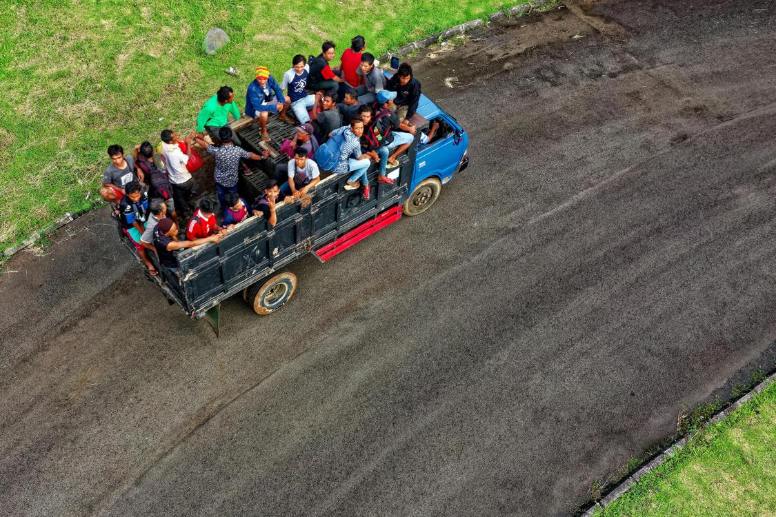 Proven Strategies to Reduce Travel Costs for Aid Workers aerial photo of people riding in truck - Proven Strategies to Reduce Travel Costs for Aid Workers