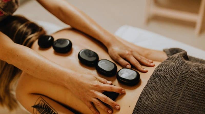 How Chiropractic Adjustments Improve Mobility woman having a massage with massage stones 800x445 - How Chiropractic Adjustments Improve Mobility