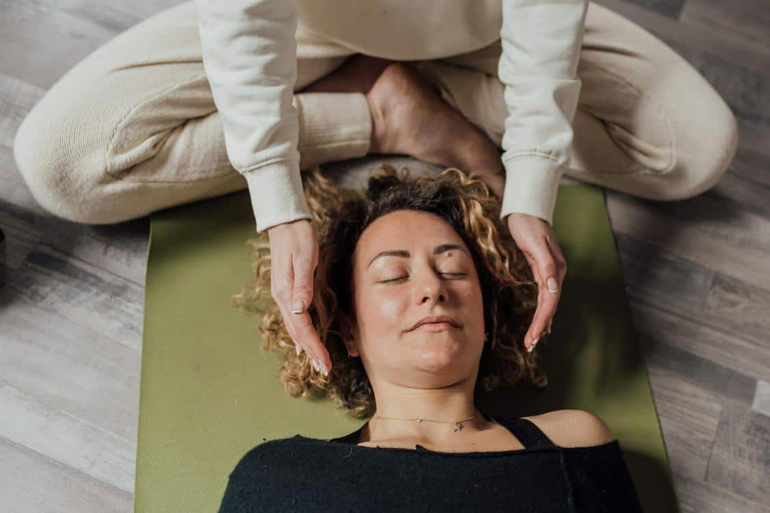 How Chiropractic Adjustments Improve Mobility woman lying on a yoga mat - How Chiropractic Adjustments Improve Mobility