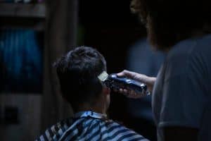 barber using electric clipper for a precise haircut in a barber shop 300x200 - barber using electric clipper for a precise haircut in a barber shop..jpg