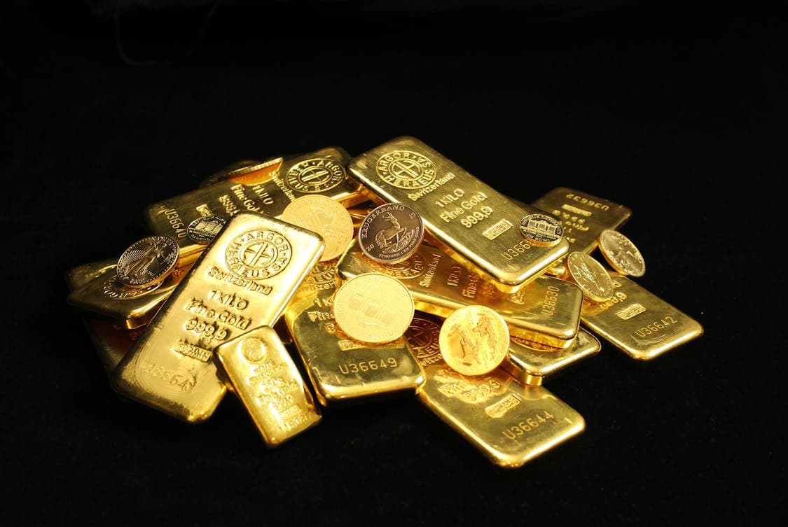 Close up Photo of Gold Bars and Coins - How to Minimize Risks in Bullion Investing for Beginners
