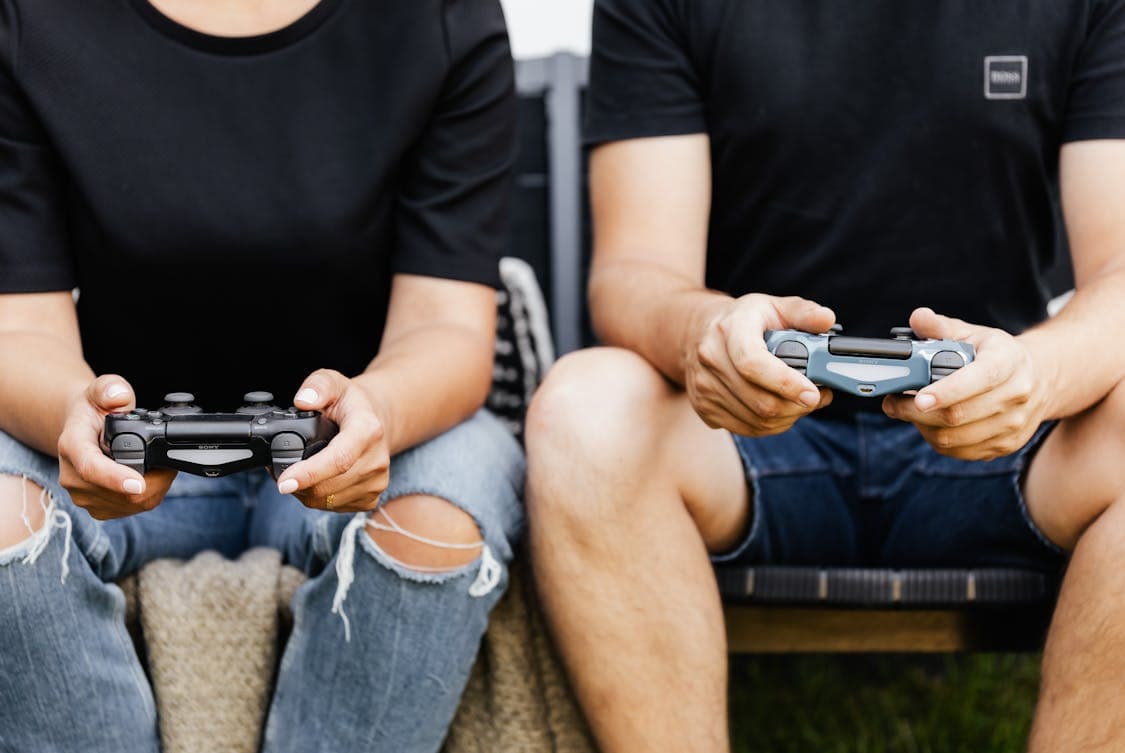 2 people holding controllers - Will FC 26 Change the Way We Play Esports? Discover Why