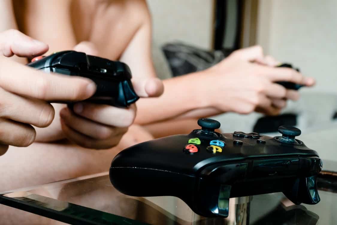 person holding game controller - Will FC 26 Change the Way We Play Esports? Discover Why