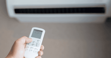 a person holding an ac remote 390x205 - 5 Common Air Conditioner Mistakes You Should Avoid
