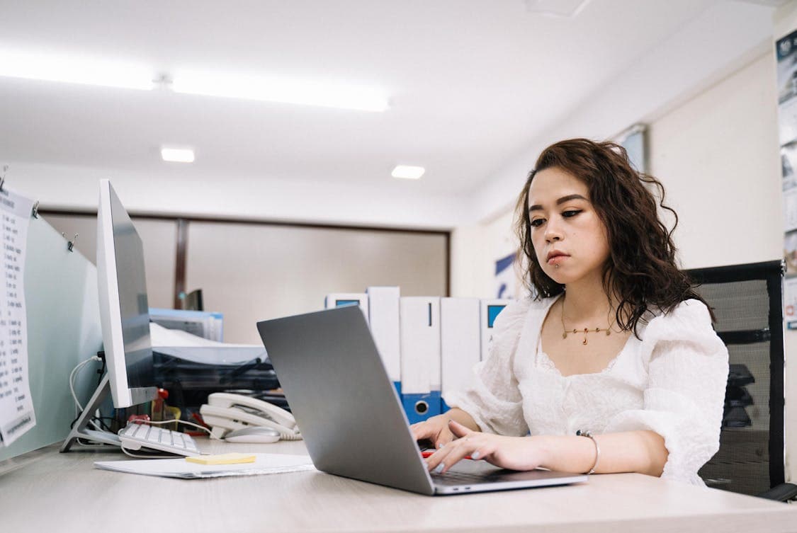 5 Ways Staffing Agencies Simplify Your Hiring Process Woman in White Lace Top Using Laptop - 5 Ways Staffing Agencies Simplify Your Hiring Process