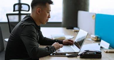 a man wearing long sleeves in the office 390x205 - Why Should You Invest in IT Services? Discover Now