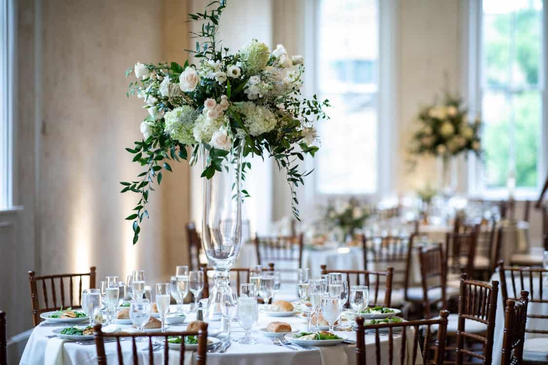 flowers on the tables - How to Use Flowers to Elevate Your Wedding Venue Decor