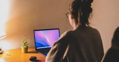 woman focuses on her laptop at a cozy home office The Time Zone Difference Crushing Remote Workers Is Forcing a Shift to Async Work