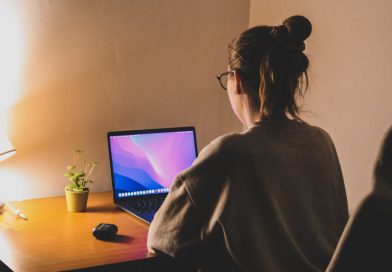 woman focuses on her laptop at a cozy home office The Time Zone Difference Crushing Remote Workers Is Forcing a Shift to Async Work