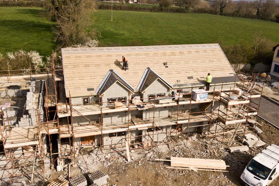 Aerial shot of a house under construction - The Plywood Tariff Quietly Raising Deck-Repair Bills on Toronto Roof Jobs